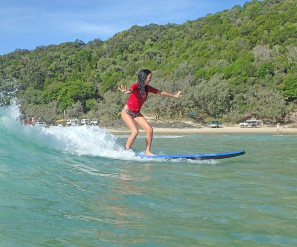 Learn to Surf Australia’s Longest Wave & Beach Drive Tour – Queensland, Australia