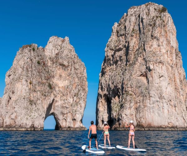 Capri: Faraglioni Rocks and Blue Grotto Paddleboarding Tour – Campania, Italy